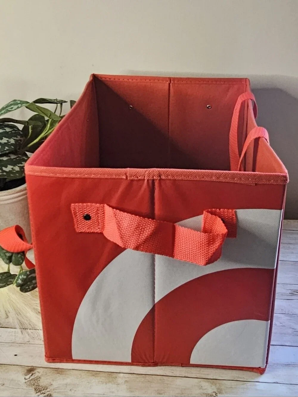 Target red collapsible box-style utility bag. It features a rectangular, boxy sh